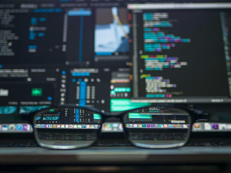 Glasses in front of screen. Data Migration